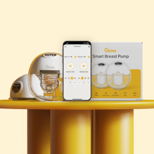 Glow’s wearable and smart breast pump with app screen in a phone tracking pumped milk